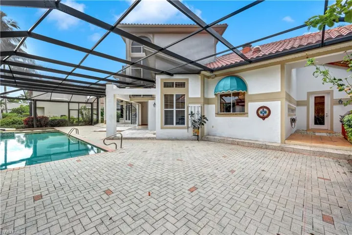 Massive pool deck is perfect for entertaining large groups. New pool cage.