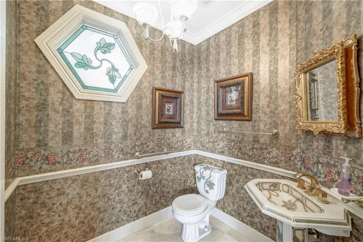 Powder bath is located on the 1st level. Custom toilet and freestanding sink.