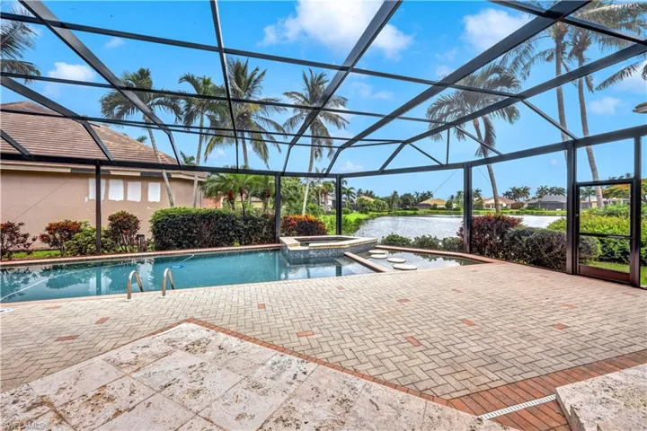View of swimming pool featuring an in ground hot tub, breathtaking views of the lake! New pool cage!