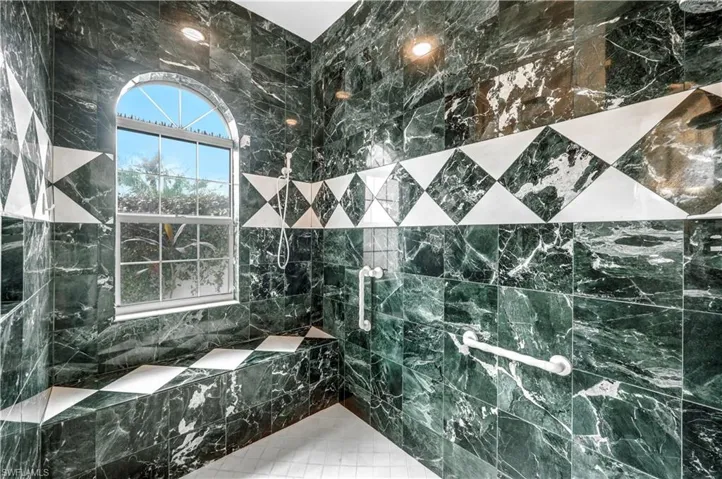 The master bath has marble tile throughout as well as the wet walls.  Fabulous!