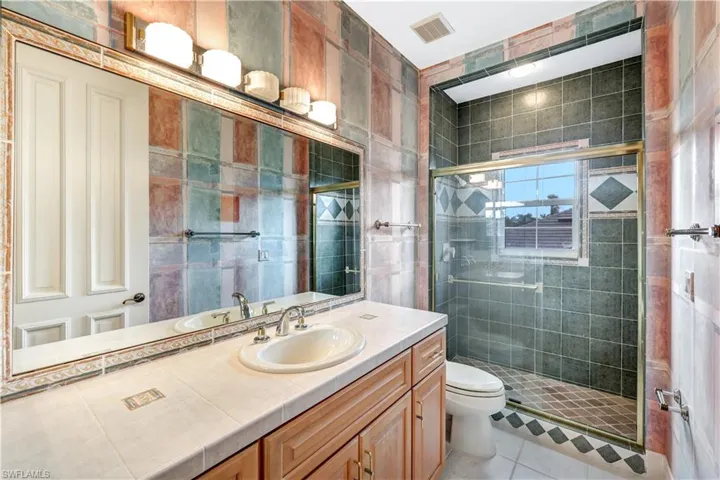 3rd full bathroom offering a walk in shower.