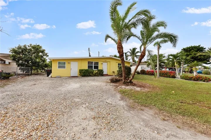 Single story home with a front lawn