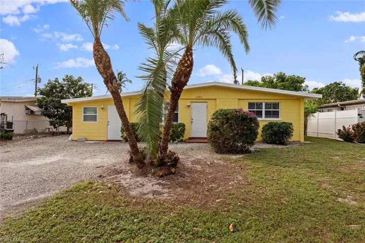 Single story home with a front lawn