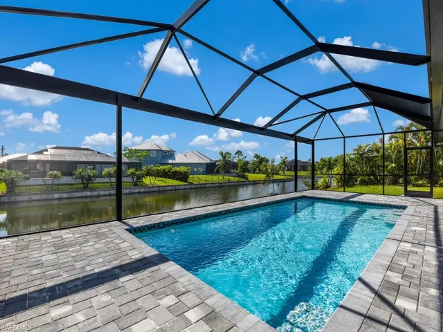 View of pool featuring a lanai and a patio area