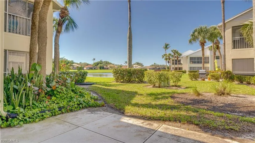 View of green lawn with a water view