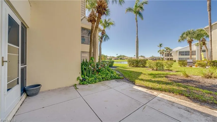 View of patio with a water view