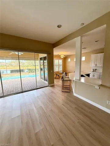 Unfurnished living room featuring ceiling fan, light wood-style flooring, and recessed lighting