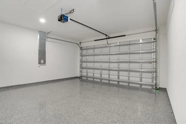 Garage featuring a garage door opener