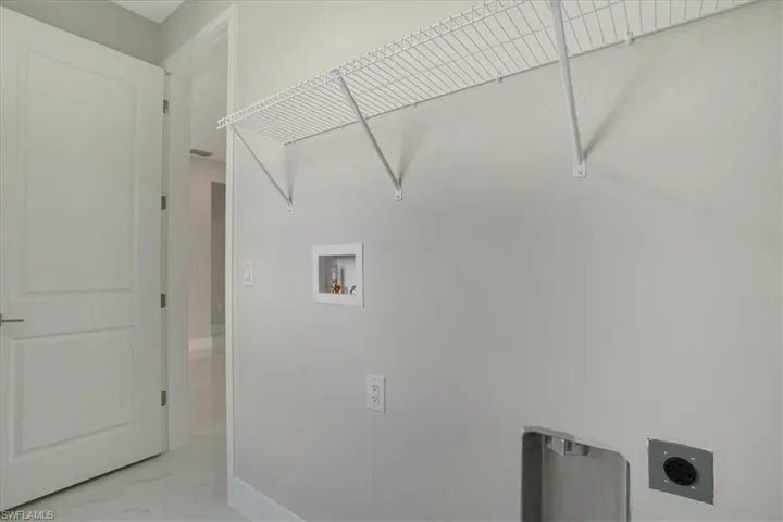 Laundry area with hookup for a washing machine and electric dryer hookup