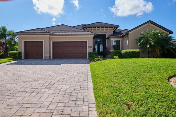 Prairie-style house with a front yard and a garage