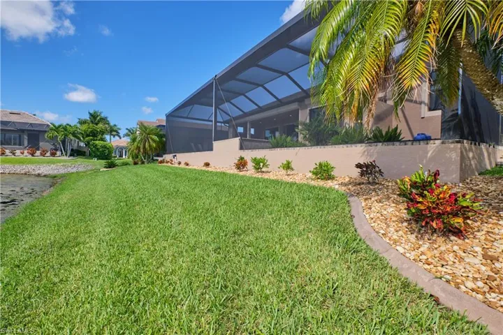View of yard with glass enclosure