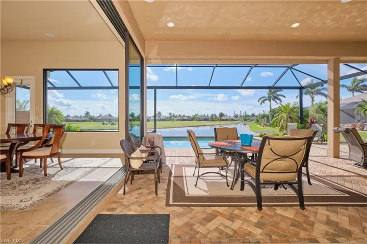 View of patio / terrace with a water view and a lanai