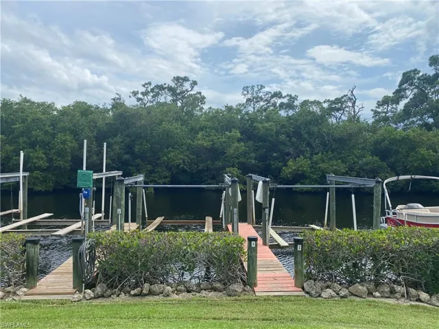 Dock area featuring a water view