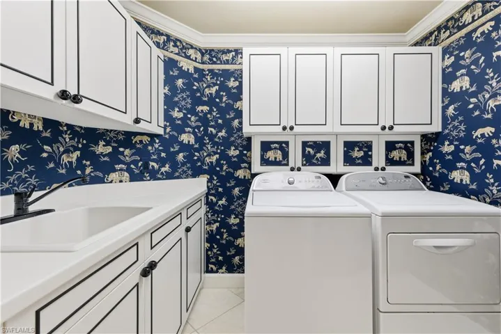 Bathroom with ornamental molding and plenty of natural light