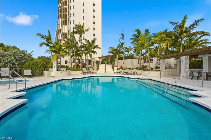 Community pool featuring a patio