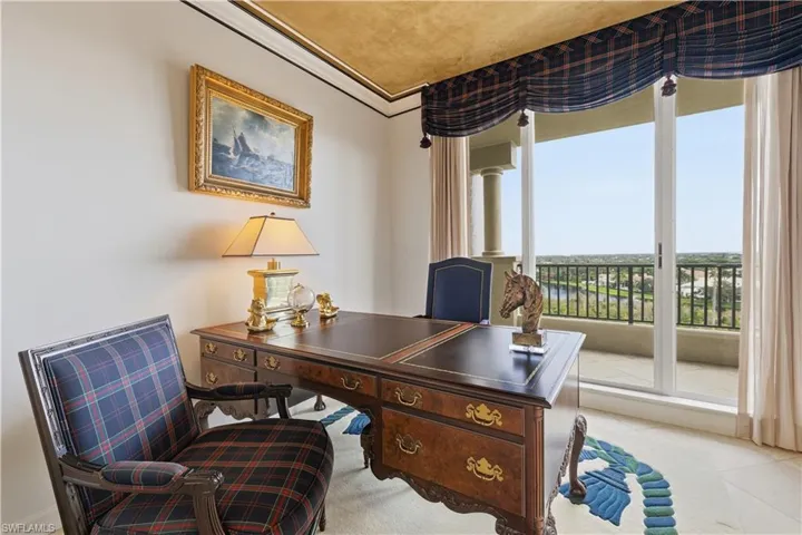 Carpeted bedroom with wallpapered walls and crown molding