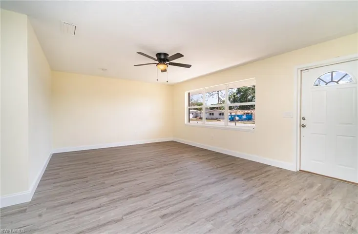 Entrance foyer featuring light wood finished floors and a ceiling fan