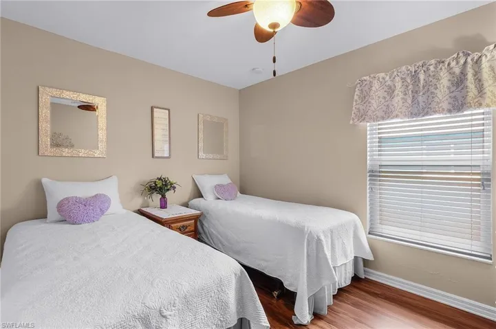 Bedroom featuring hardwood / wood-style floors and ceiling fan