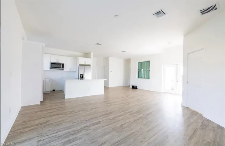 Unfurnished living room featuring light hardwood / wood-style flooring