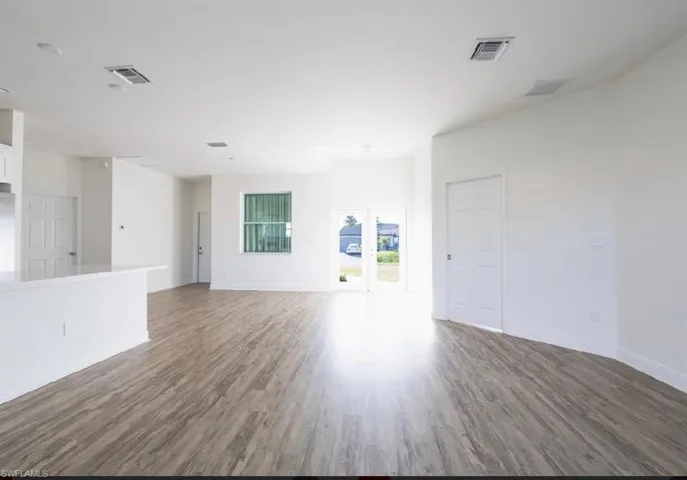 Spare room with wood-type flooring
