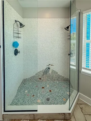 Full bath with a shower stall