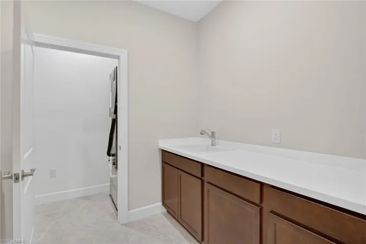 Bathroom with vanity and baseboards
