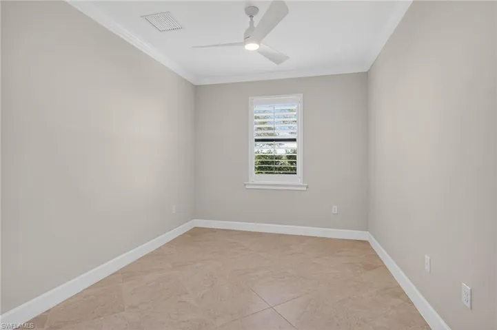 Unfurnished room featuring crown molding and ceiling fan