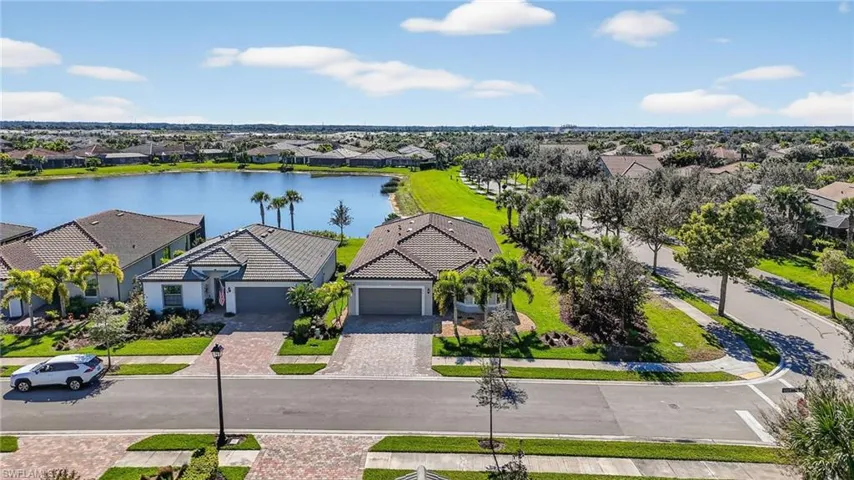 Aerial view of residential area featuring a large body of water