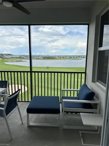 Balcony featuring a water view.