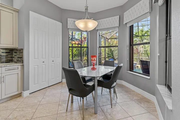 Dining room with light tile patterned floors