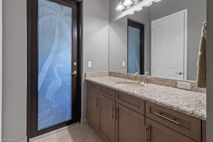 Bathroom featuring vanity and tile patterned floors