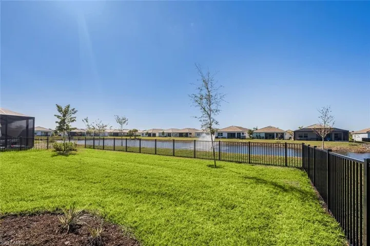Backyard featuring water fountain in lake