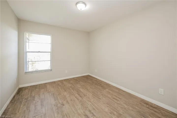 Unfurnished room featuring light wood-type flooring