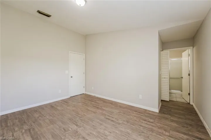 Spare room with hardwood / wood-style flooring