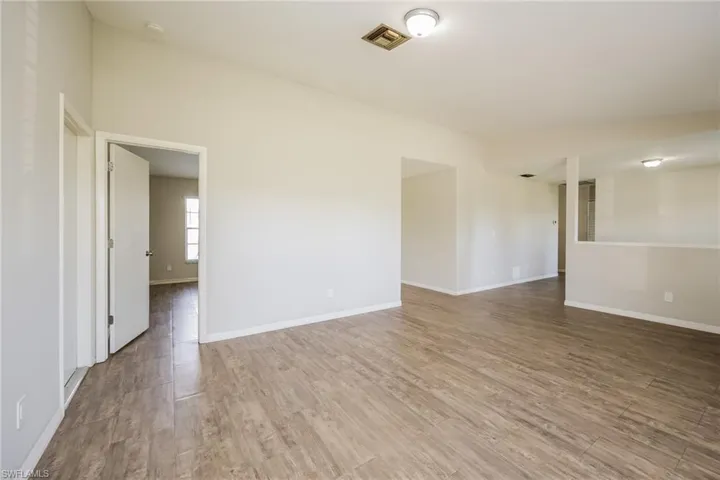 Unfurnished room with hardwood / wood-style floors