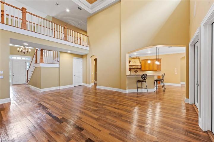 View of bar area in the kitchen and upstairs breezeway from the living room