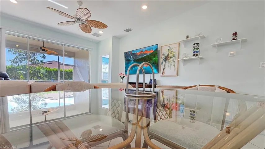 Dining room with ceiling fan and tile patterned flooring