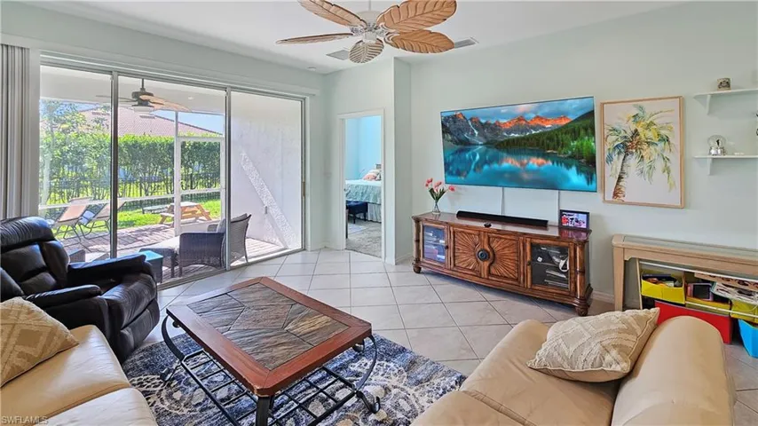 Tiled living room with ceiling fan