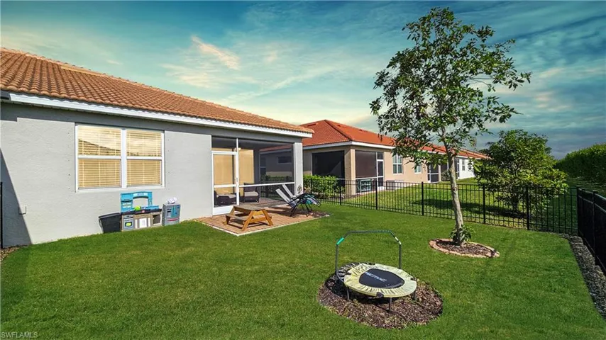 Back of house with a screened in lanai