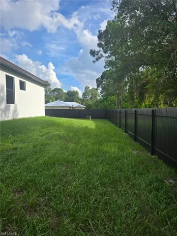 View of side of home featuring stucco siding