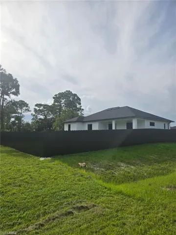 View of fenced backyard