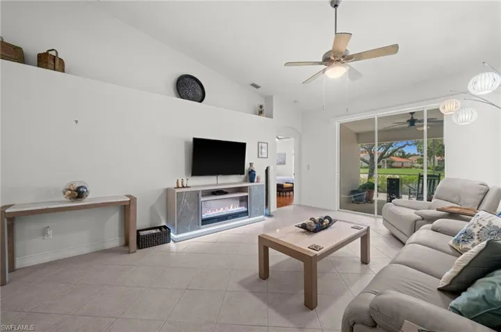 Vaulted ceilings and tile flooring enhance this living space