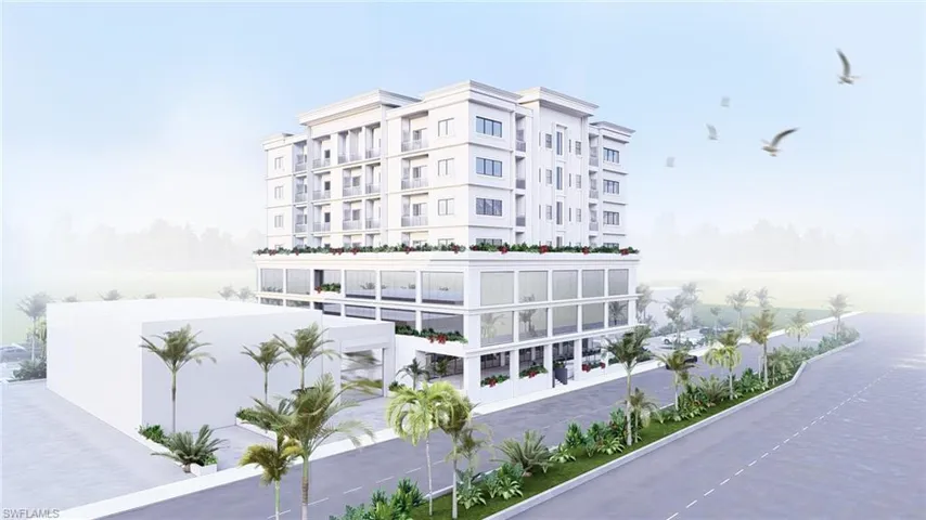 View of apartment building / complex with a water view