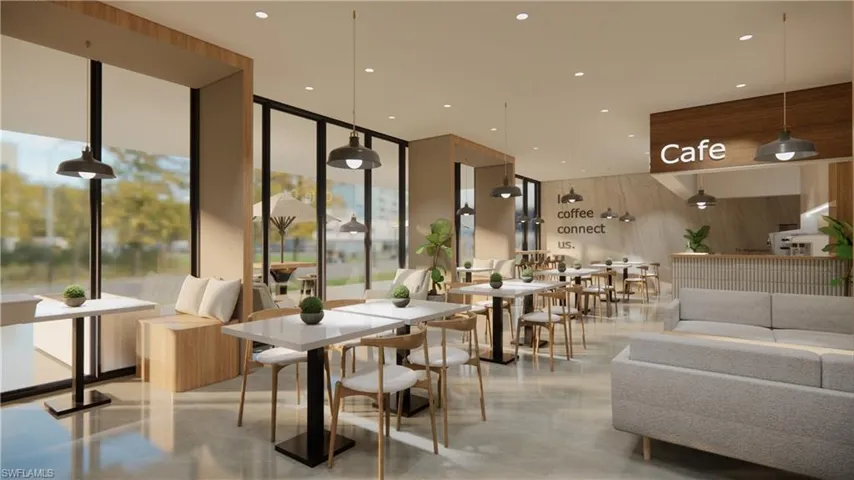 Lobby with floor to ceiling windows, wood walls, and recessed lighting