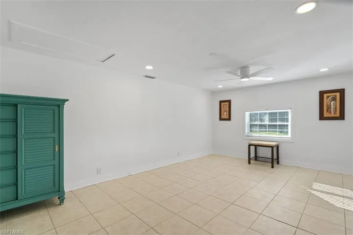 Spare room featuring recessed lighting, ceiling fan, and light tile patterned floors