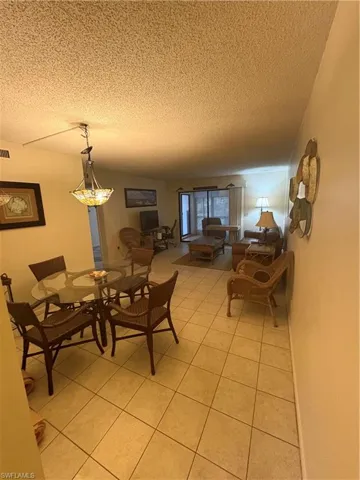 Tiled flooring extending throughout the dining and living areas
