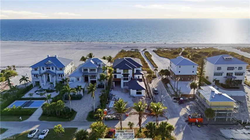 Aerial view of residential area with expansive coastline
