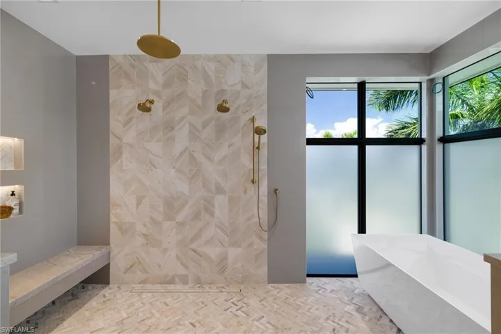 oversized shower with multiple fixtures