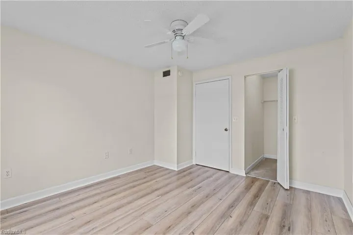 Unfurnished bedroom featuring light wood-style flooring and ceiling fan