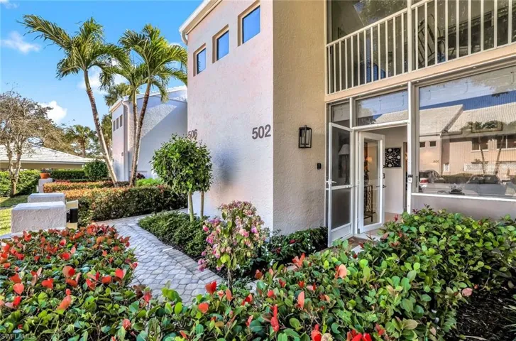 View of exterior entry featuring stucco siding
